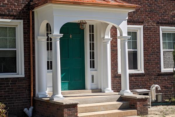 Copper Roof Entry by Kevin Hazlett & Tiernan King Structure built by Woodland Design Co., LLC