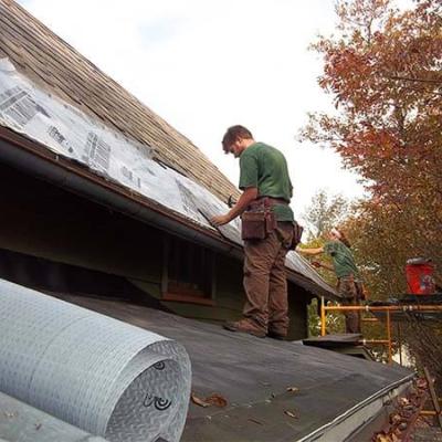 Bottom courses of slate removed, rotten bottom deck board replaced.