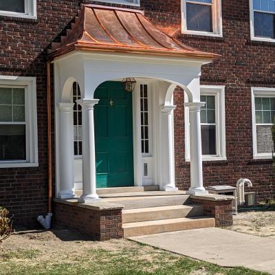 Copper Roof Entry by Kevin Hazlett & Tiernan King Structure built by Woodland Design Co., LLC